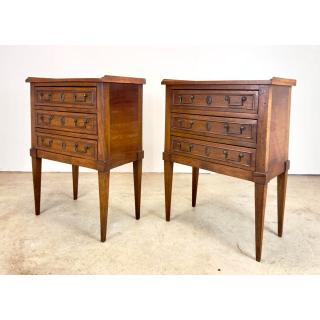 A gorgeous small scale pair of Louis XVI three-drawer nightstands made in Italy for Bloomingdale’s circa early 20th...