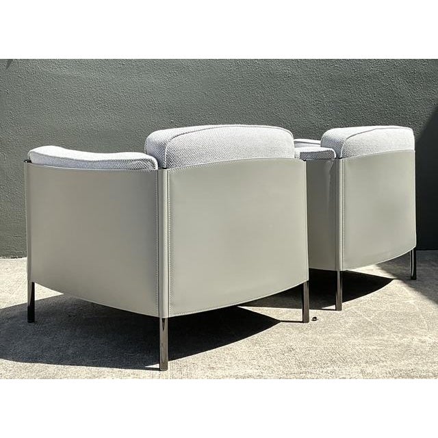 This pair of Minotti "Shelley" lounge chairs exemplifies the height of contemporary Italian design, offering a...