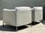 This pair of Minotti "Shelley" lounge chairs exemplifies the height of contemporary Italian design, offering a...