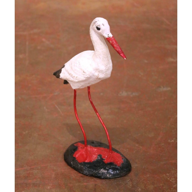This charming antique garden sculpture was crafted in France circa 1960 and depicts a standing stork rendered in a rustic...