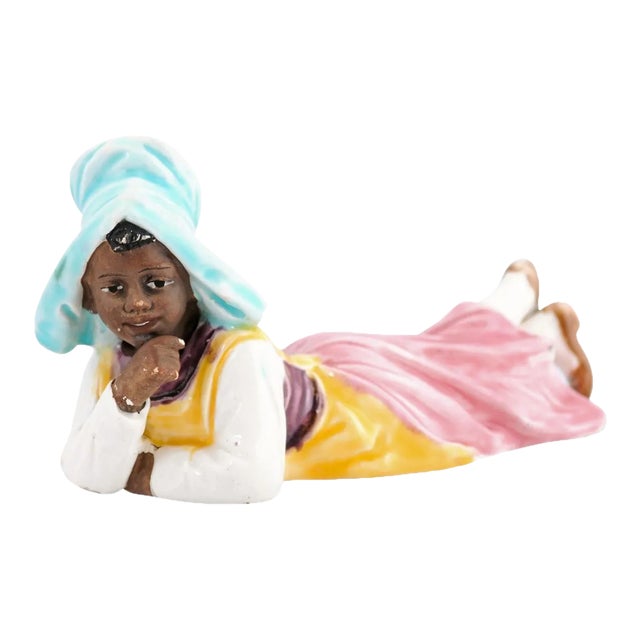 Vintage Petite English Porcelain Figurine Depicting a Young Girl Laying on the Ground For Sale