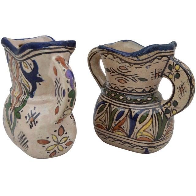 Set of two antique handcrafted and glazed Moroccan ceramic vases with handles from Fez. Featuring an elaborate hand-...