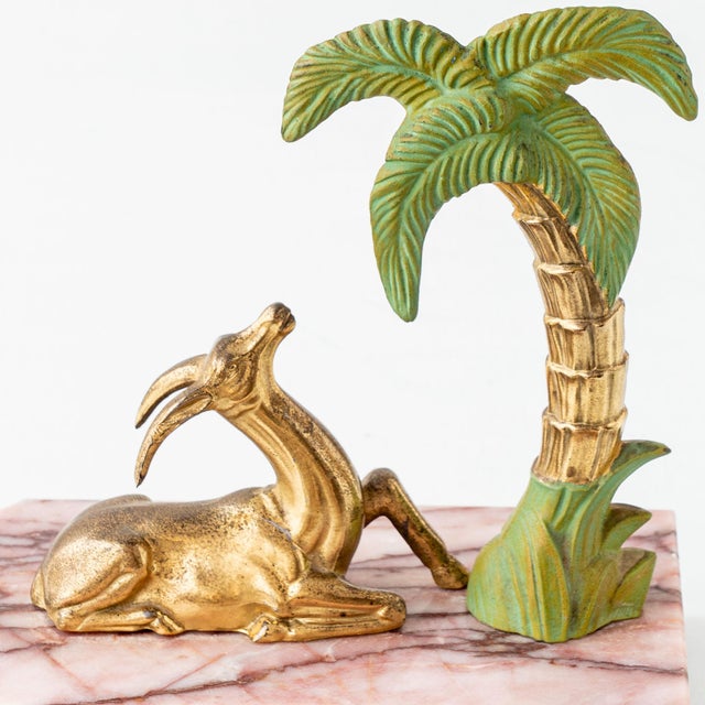 Hollywood Regency / Palm Beach style. Evoking the glamour of French Art Deco, this figural pair of weighty bookends...