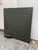 Design Plus Gallery presents a Display Panel with Studs and Shelf. The gray metal panel is a perfect square with a grid of...