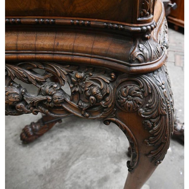 A gorgeous Queen Anne revival cocktail cabinet in walnut Circa 1920 on this gorgeous piece of vintage furniture Stands on...