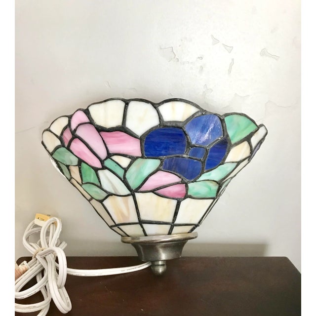 This vintage artisan wall scone is ready to be hung in a foyer or living room! Cream vase with cobalt blue and pink flower...