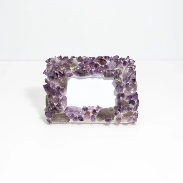 This Kathryn McCoy frame, adorned with amethyst, is a perfect blend of elegance and natural beauty. The frame showcases...