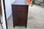 The minimalist design is elevated by subtle industrial detailing, including exposed hardware accents and sleek brass-...