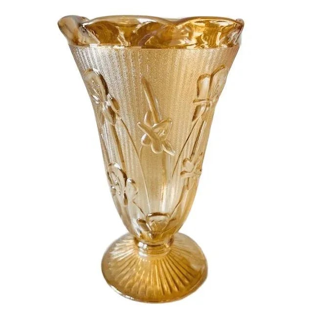 A beautiful vintage Jeannette iridescent peach carnival glass vase from the 1950s. The golden iridescent sheen catches the...