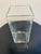 This elegant clear glass vase features a modern, rectangular design with a clean, square base. Its minimalist aesthetic...