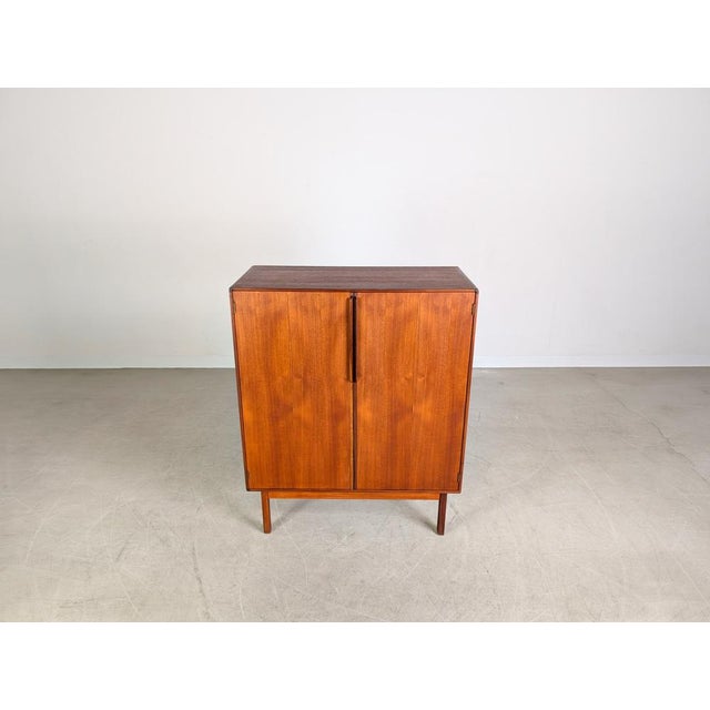 Beautiful vintage cabinet from Asko Finland, dating from the 1960s, for sale. Behind two large doors, the piece offers...