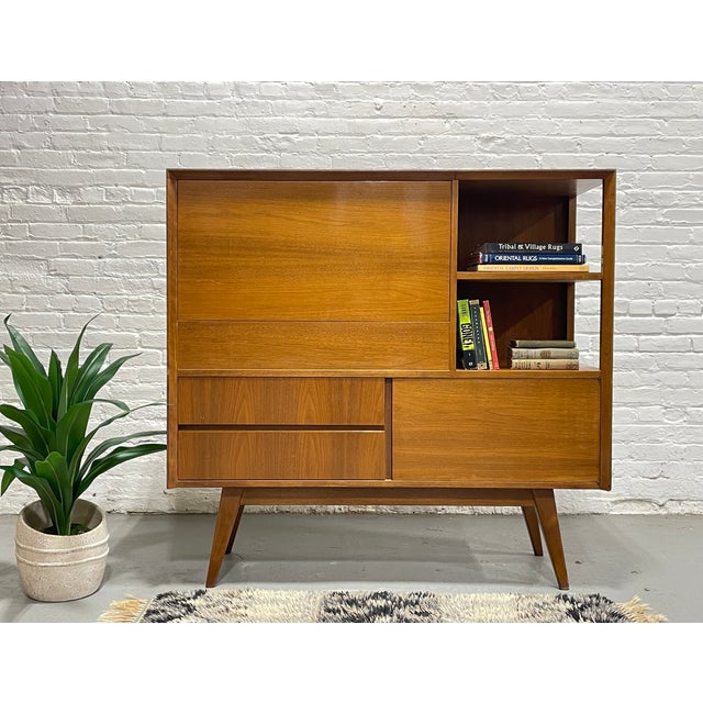 Exceptional Danish Mid Century Modern Danish Dry Bar, c. 1960's. This multi-functional piece has it all - a drop down bar...