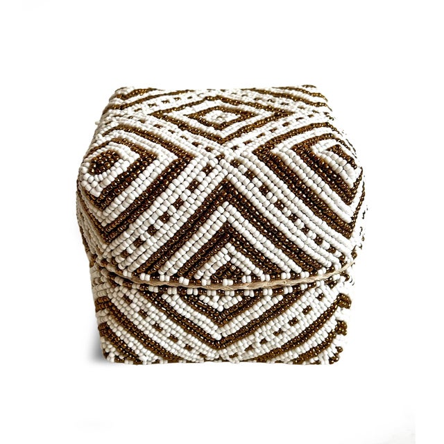 Beautiful hand beaded accessory box made from woven bamboo and intricately covered with geometric triangle patterns of...