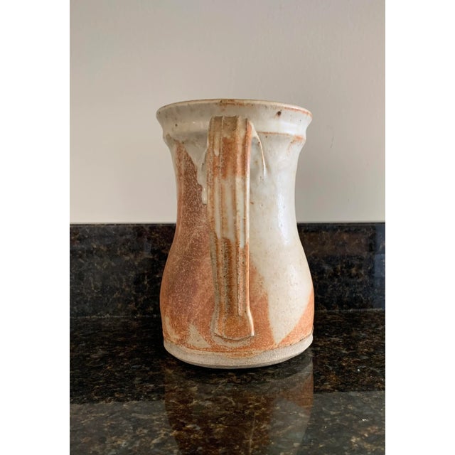 Studio pottery decor pitcher Wonderful muted colors. Signed In wonderful condition. Not sure if it can be used for other...