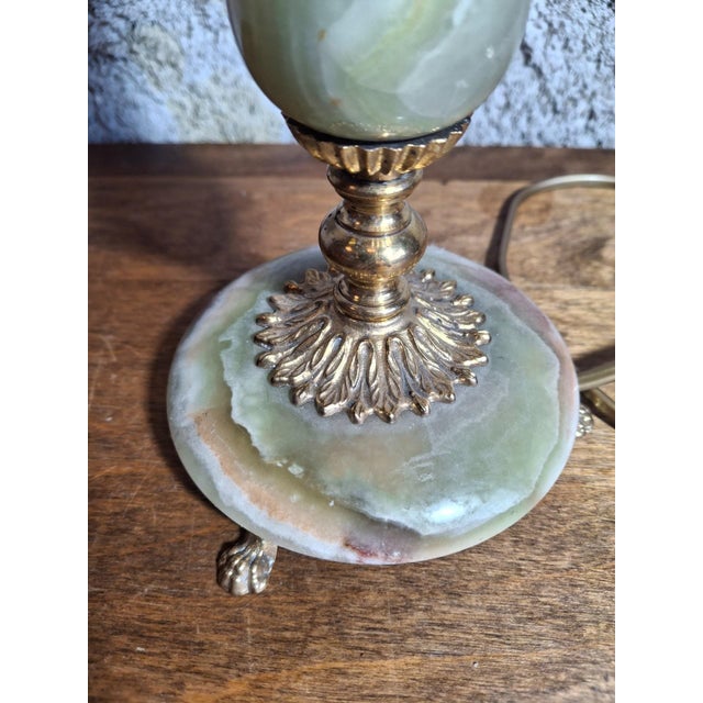 Table lamp with a translucent green onyx stem, veined with white and brown, turned into a pear-shaped vase. Italian or...