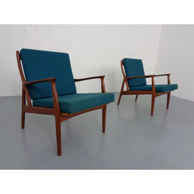Lightly organic, Danish armchairs in teak. Original cushions & covers.