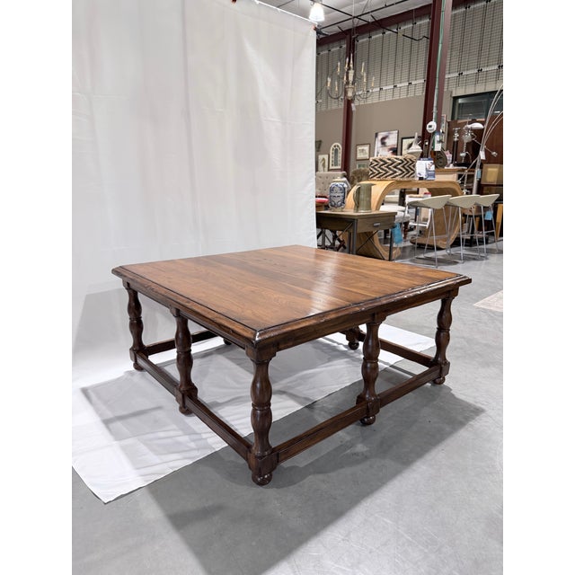A substantial American-made cocktail table from Woodland Furniture’s Grayson collection, crafted with a richly figured...
