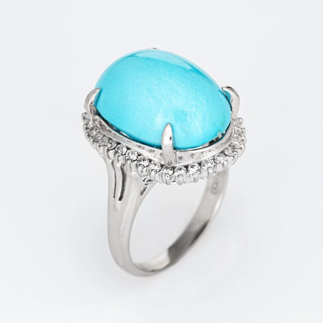 Stylish egg shell blue turquoise & diamond cocktail ring crafted in 900 platinum. Turquoise cabochon measures 18mm x 13mm...