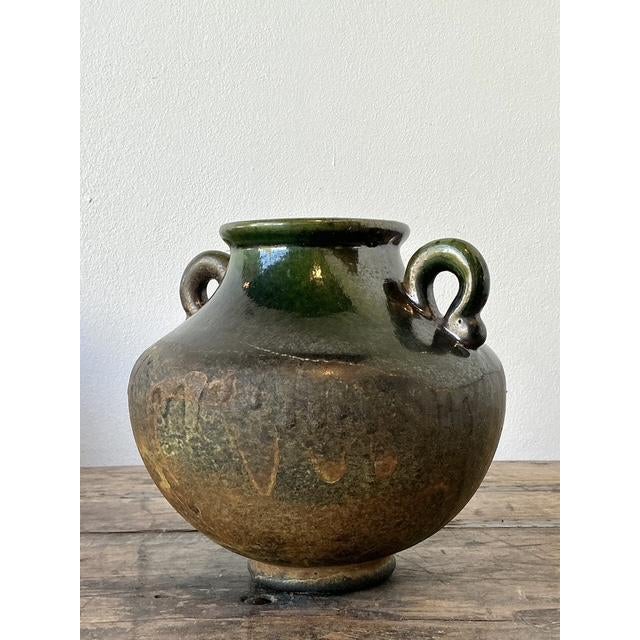 This striking studio pottery vessel is a masterclass in textural contrast and organic form, capturing the soulful spirit...
