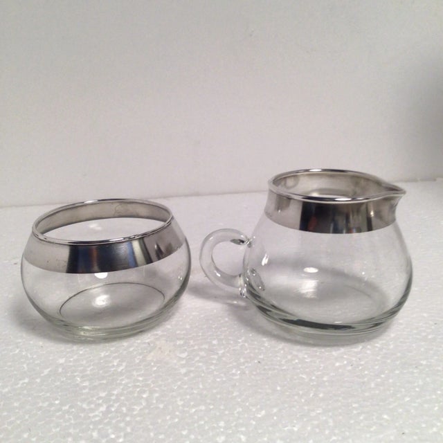 Mid-Century Modern Dorothy Thorpe silver banded bistro set that includes a creamer and sugar bowl set that’s measurements...