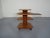 This table has multi-level tiers and adjustable sides by Aksel Kjersgaard in solid teak. This piece has an attribution...