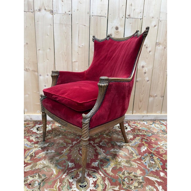 An Art Nouveau bergère chair, made in France in the early 20th century, crafted from turned and stained wood with an...