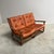 Danish sofa from the 1970s. Bamboo / manou frame with cognac leather cushions. Sofa is in good condition with patina and...