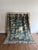 A French antique tapestry with ornate detailing, showcasing intricate patterns and rich textures. Its refined...