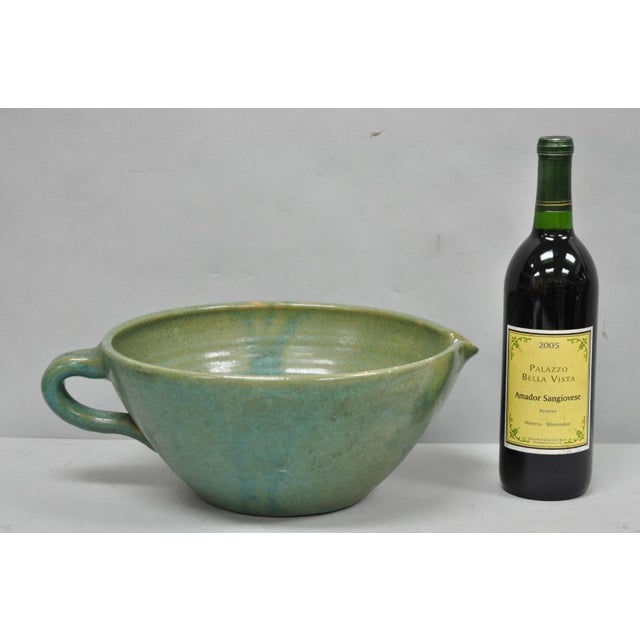 Vintage Primitive Green Glazed Ceramic Pottery Large Mixing Bowl with Handle and Ridged Interior. Circa Mid 20th Century....
