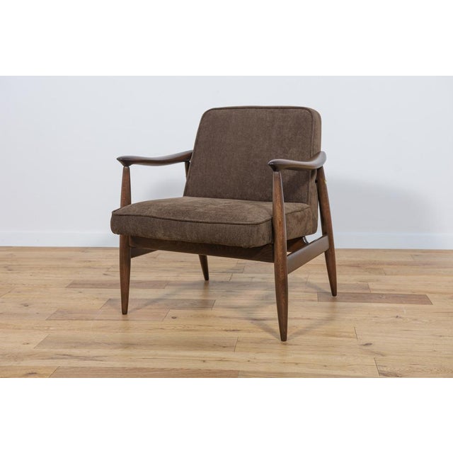 Polish armchair produced in Gościcińskie Fabryki Mebli in the early 1960s. This project, due to the specific profile of...