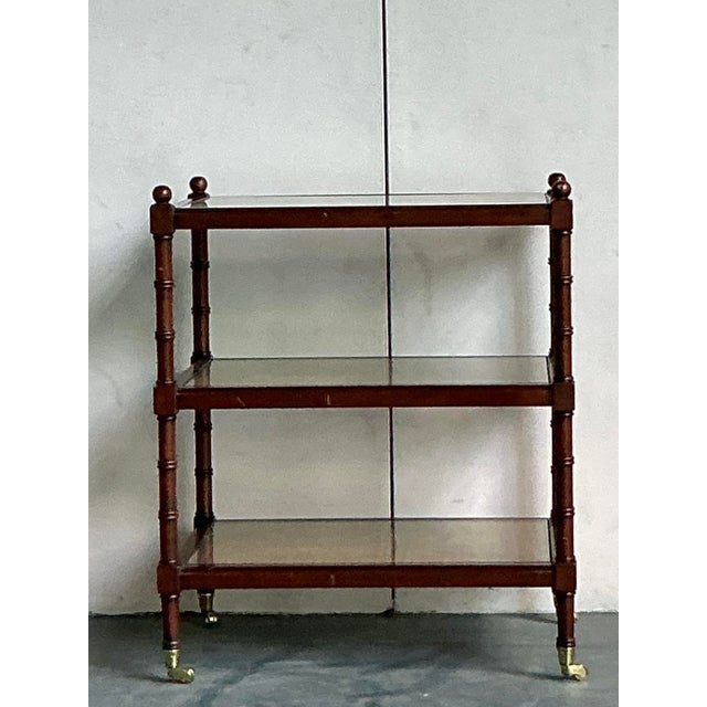 Discover the timeless appeal of Chinoiserie with this elegant vintage three-tier étagère. Masterfully crafted from wood...