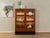 Classic showcase from the 1980s. High-quality corpus in teak veneer with two glass doors, two shelves, two drawers and a...