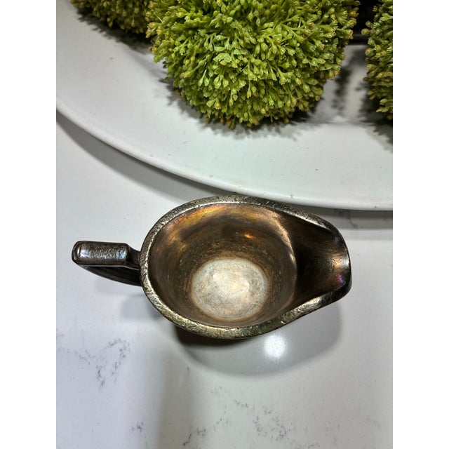 The base of this vintage silver-plated hollowware piece is stamped with the hallmark for the International Silver Company...