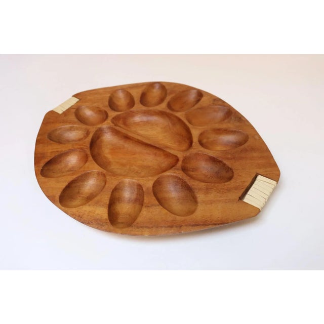 Mid-Century Modern deviled egg tray (model #531) in taverneau wood with rattan-wrapped handles designed by Arthur Umanoff...