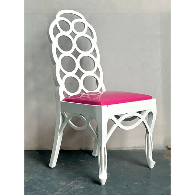 This iconic side chair is a bold statement piece, drawing direct inspiration from the highly celebrated Loop Chairs...