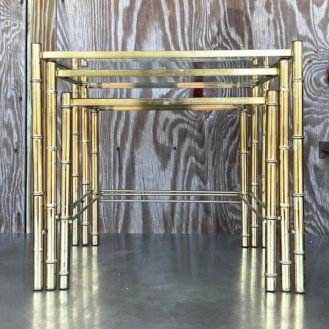 Enhance your decor with these Vintage Boho Brass Bamboo Nesting Tables. Their elegant brass bamboo design and versatile...
