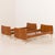 This pair of Danish teak single beds was made some time in the 1950s. Crafted from solid teak and teak veneer, it embodies...
