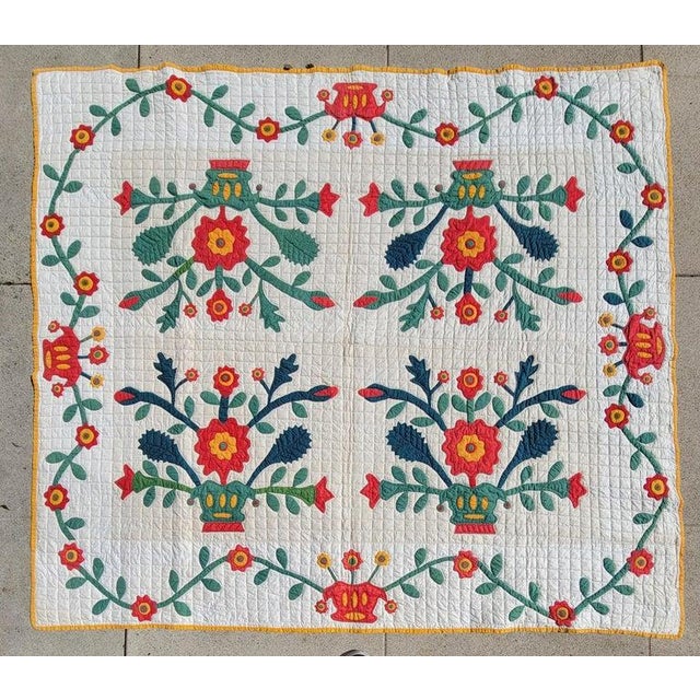 19th C Applique quilt from Pennsylvania in good condition with swag floral border.This is quite unusual and unique.