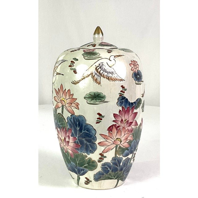 Hand painted porcelain ginger jar, with a crane and lotus motif