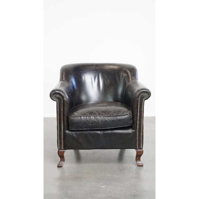 Offered this fun and cool black grained cowhide leather armchair/ armchair with a beautiful design. This nice black...