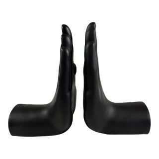 A Pair of Black Ceramic Hands Book Ends For Sale