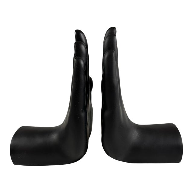 A Pair of Black Ceramic Hands Book Ends For Sale