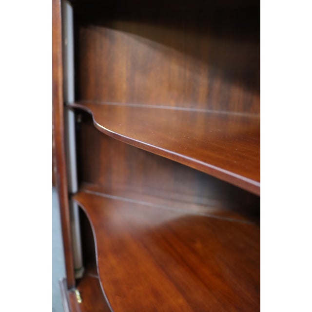 Crafted by Henkel Harris in genuine mahogany, this elegant corner cabinet combines traditional design with functional...
