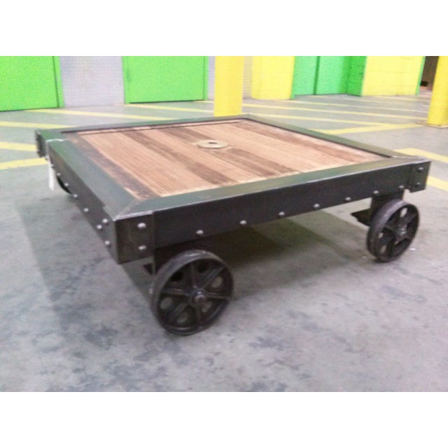 Antique late 19th century French dolly cart. This could easily be used as a awesome industrial coffee table. Seller notes...