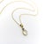 This 14k gold necklace features a 2.5 carat moonstone, beautifully mounted with a Ceylon sapphire on a delicate chain. The...