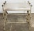 Vintage Hollywood Regency style gilt metal vanity bench with rope detail to frame. Wood bench is covered in a metallic...