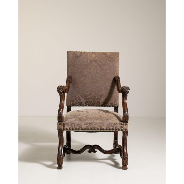 A dramatic Neo-Baroque armchair featuring bold carving and a highly expressive silhouette, reflecting the 19th century...