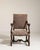 A dramatic Neo-Baroque armchair featuring bold carving and a highly expressive silhouette, reflecting the 19th century...