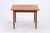 Vintage teak dining table with a practical extension mechanism and a beautifully grained tabletop. The restored surface,...