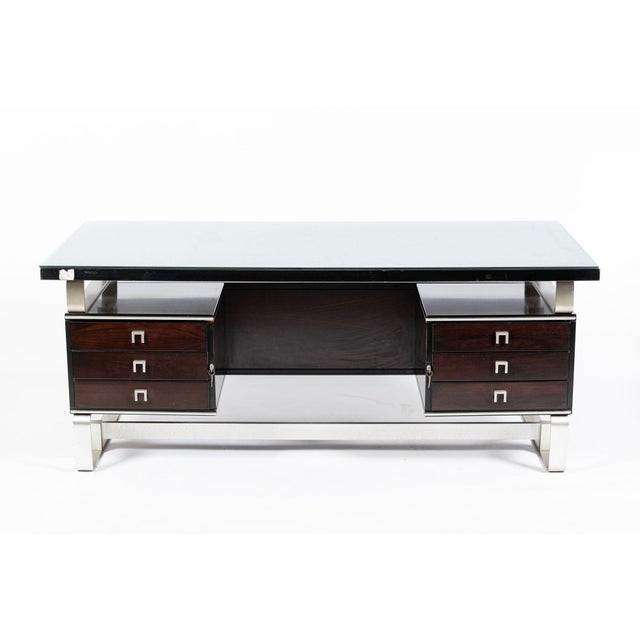 This exceptional vintage Italian wood and metal office desk by Abbondinterni Milan was produced in Italy circa 1970. The...